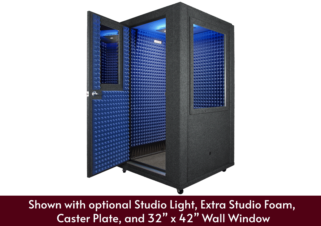A WhisperRoom 4848 S shown from the front with door open, extra blue foam, a studio light, wall window, and caster plate.