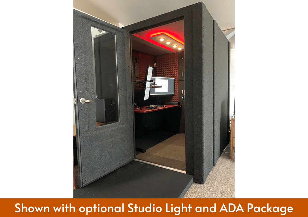 A WhisperRoom sound booth MDL 7272 S shown with the ADA package and Studio Light with various recording gear inside.