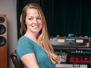 Mastering Engineer Kim Rosen sitting at her audio workstation