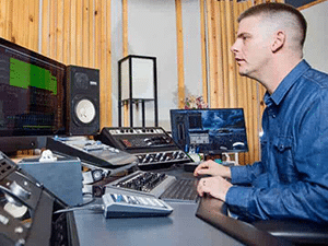 Matty Harris producing music at his console
