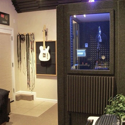 A WhisperRoom vocal booth inside of a home studio