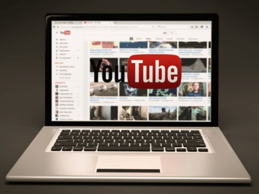 YouTube being displayed on a laptop teaches growing on YouTube as a musician.