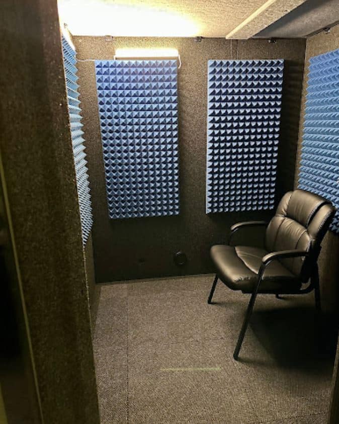Image of a chair inside of a WhisperRoom audiometric booth at Hearing AuD's office.