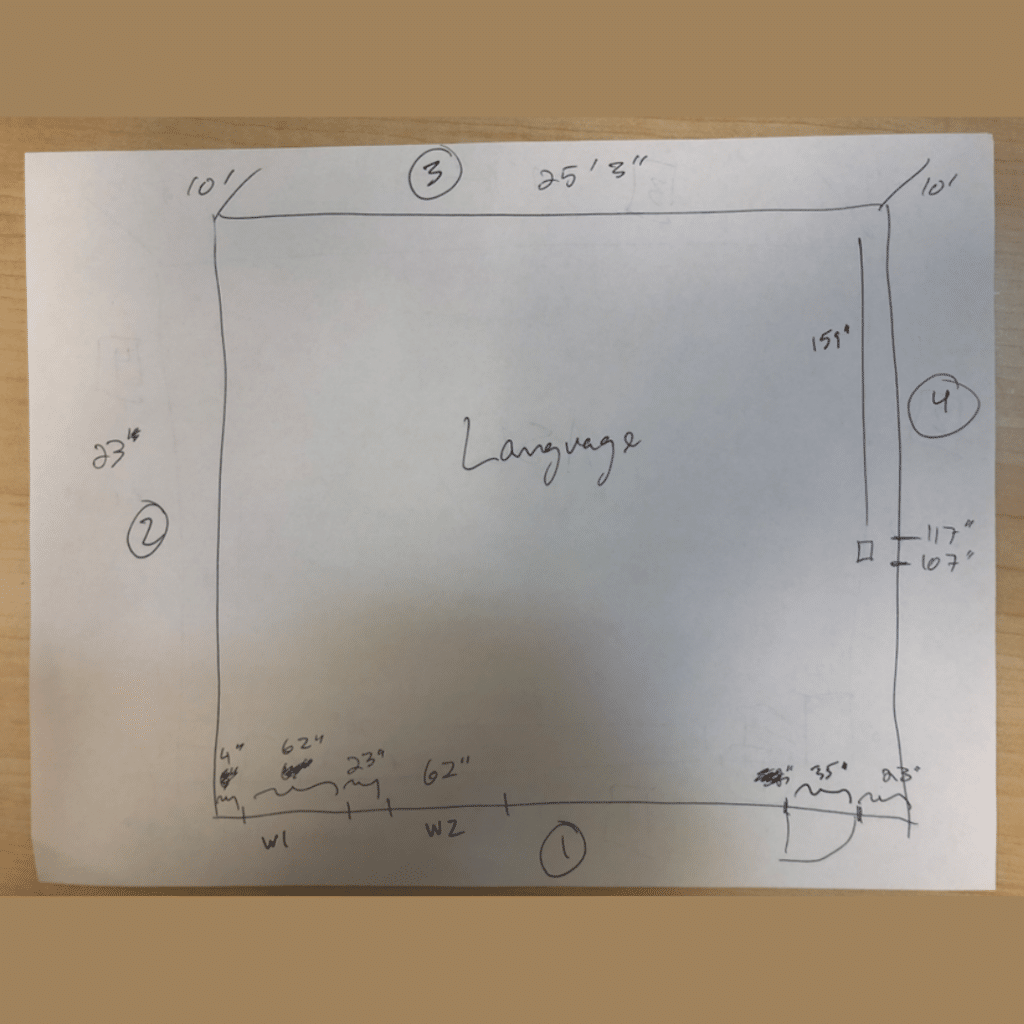 Hand-drawn diagram illustrating the floor space layout of a room, providing a visual representation of the room's dimensions and design.